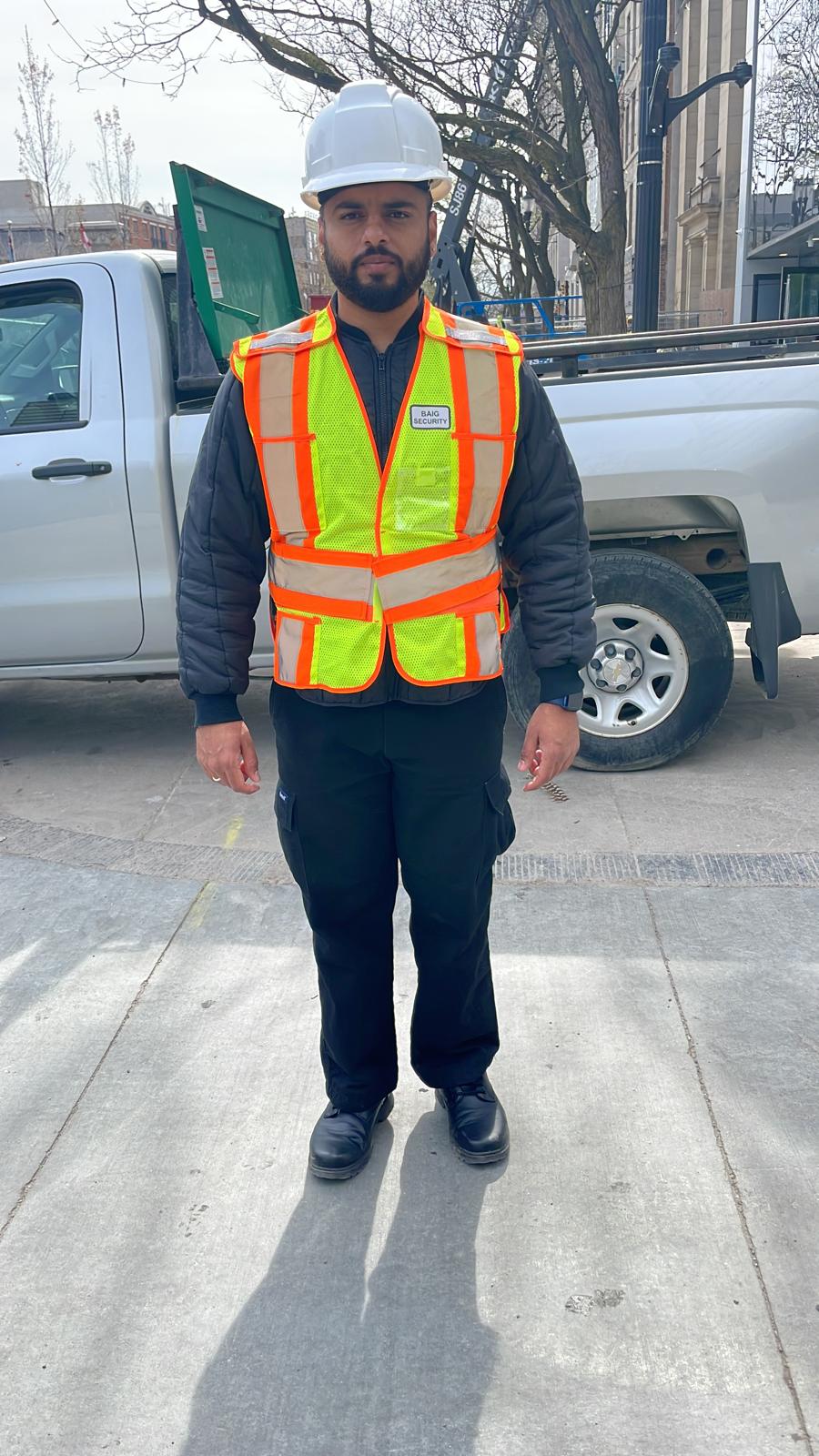 A male security guard from Baig Security actively mobile patrolling the area