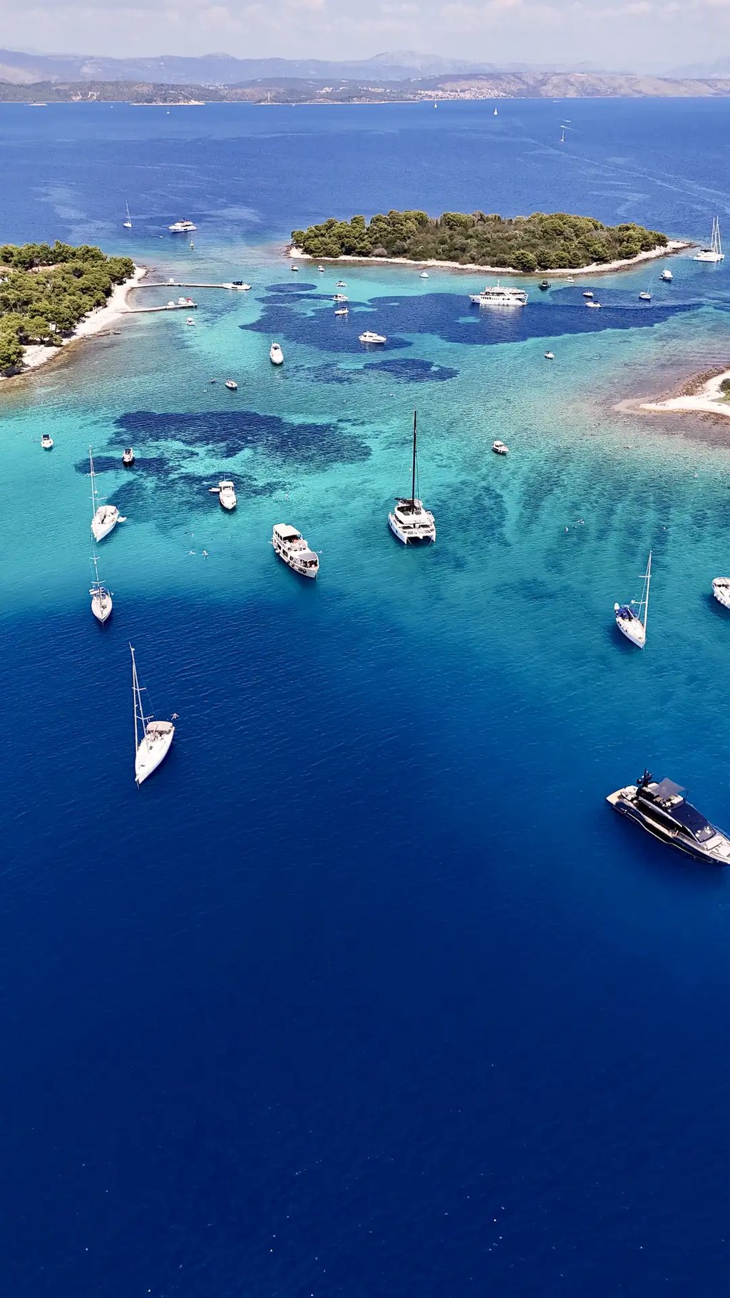 Aerial panoramic view of Blue Lagoon at Drvenik Veliki Island, seen on a private boat tour from Split, Croatia.
