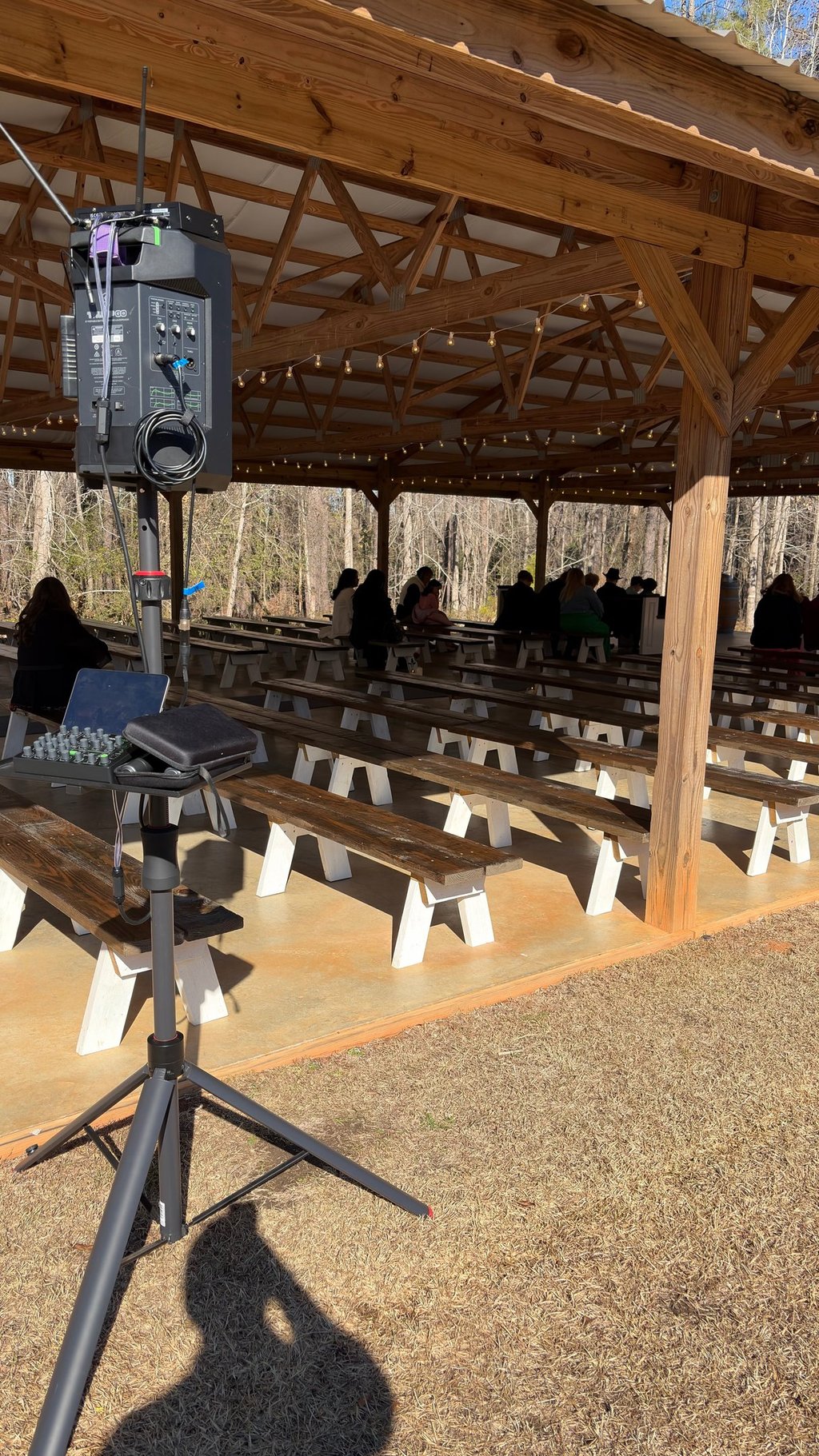 Professional DJ setup with Mackie Thump GO and tripod