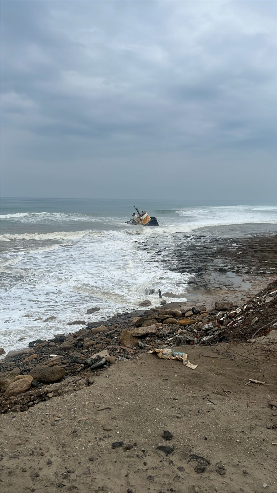 View of the shipwreck and waves