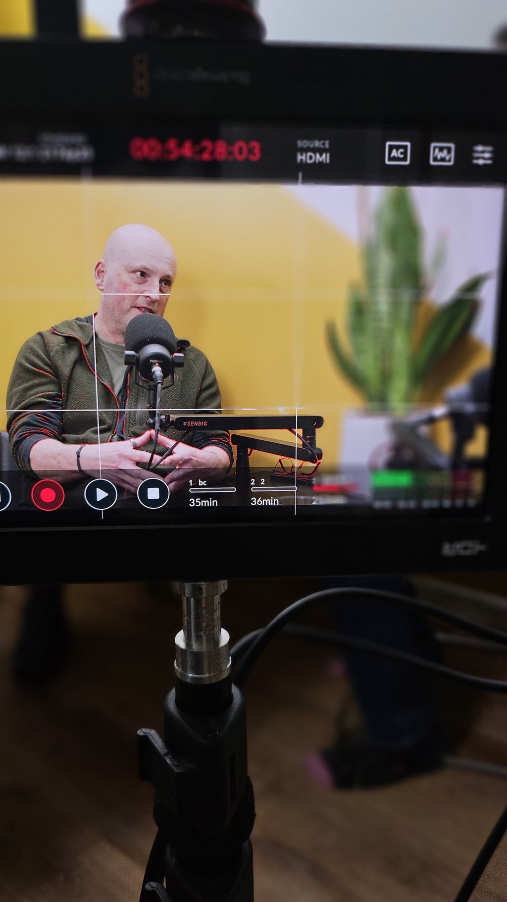 Shot of podcast guest through video monitor