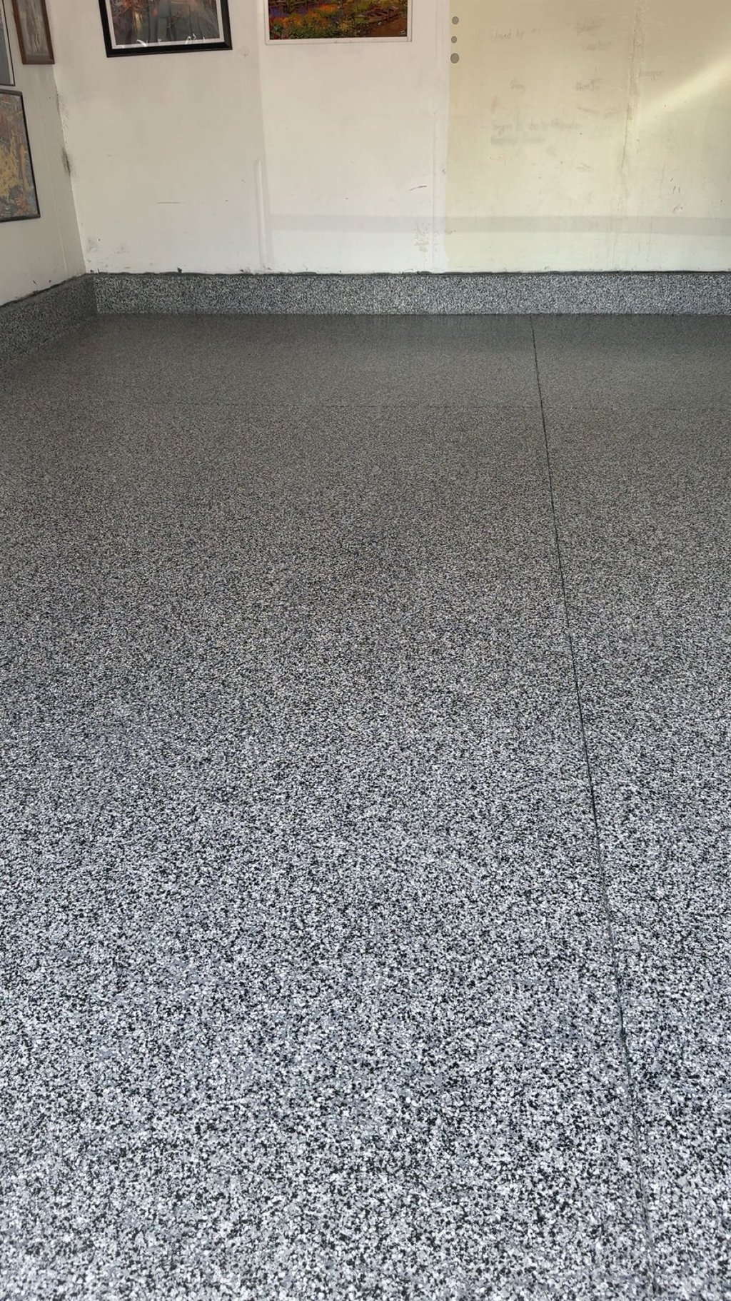 After of Home garage with domino flake floor in Grand Island home.