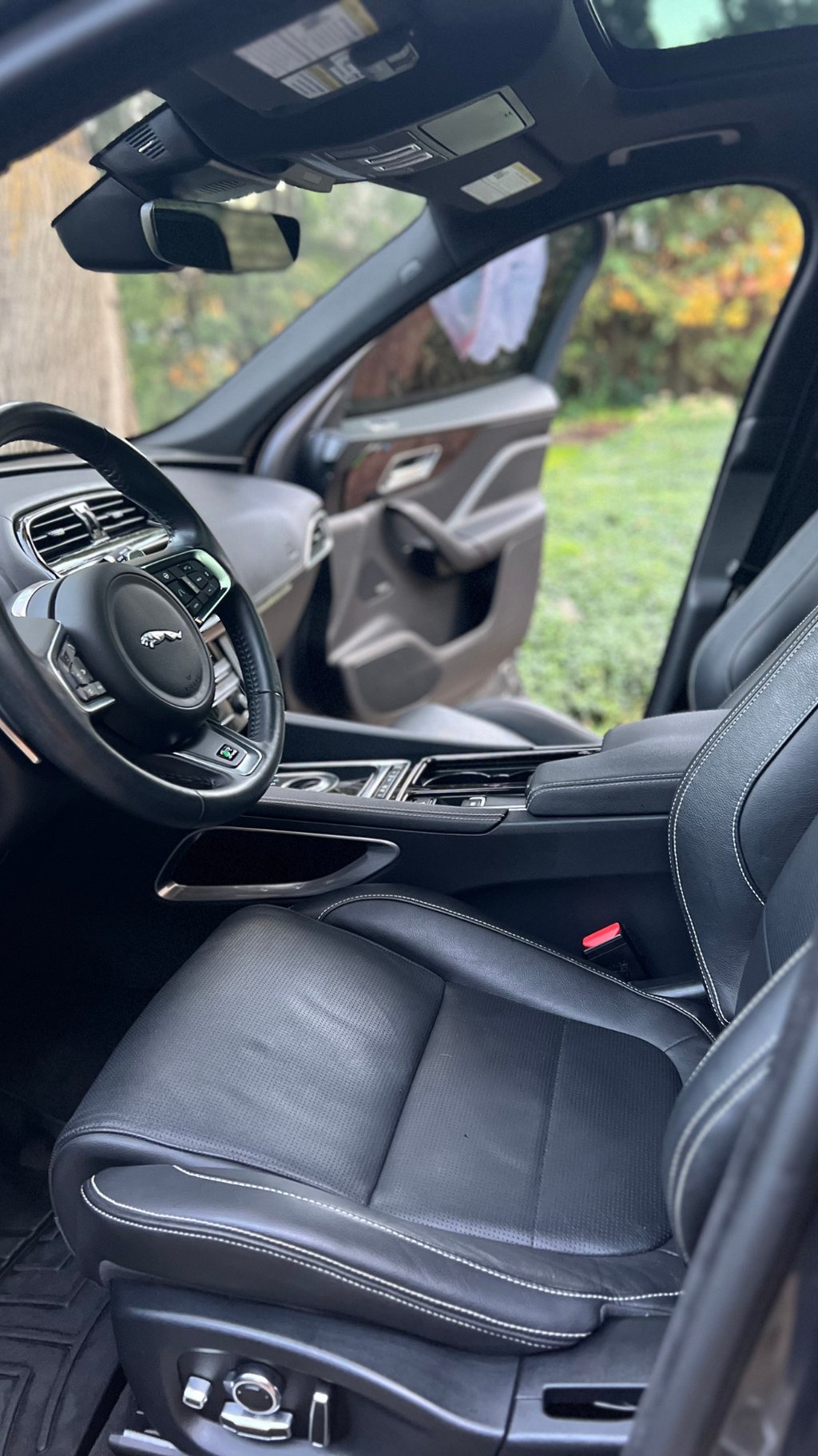 Sanitized SUV interior with clean cupholders and debris-free console