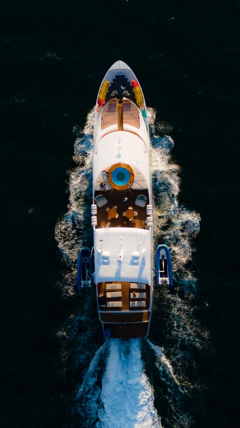 Luxury expedition yacht navigating pristine ocean waters, offering boutique cruise experiences