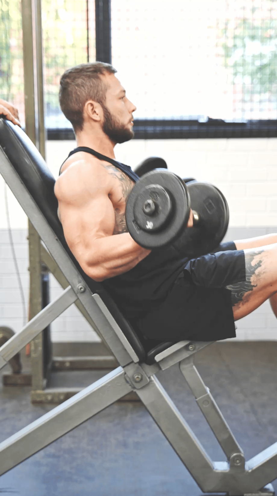 Jackson Demonstrating form and focus on a dumbell curl