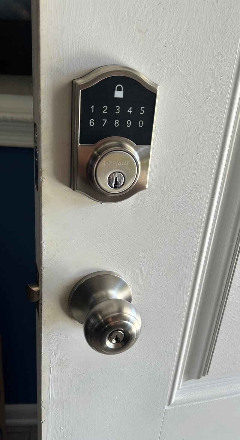 residential locksmith rekeying a door lock at a home in Volusia County