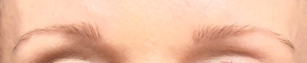Close up of tinted light eyebrows showing fuller, more defined shape after at home brow tinting.
