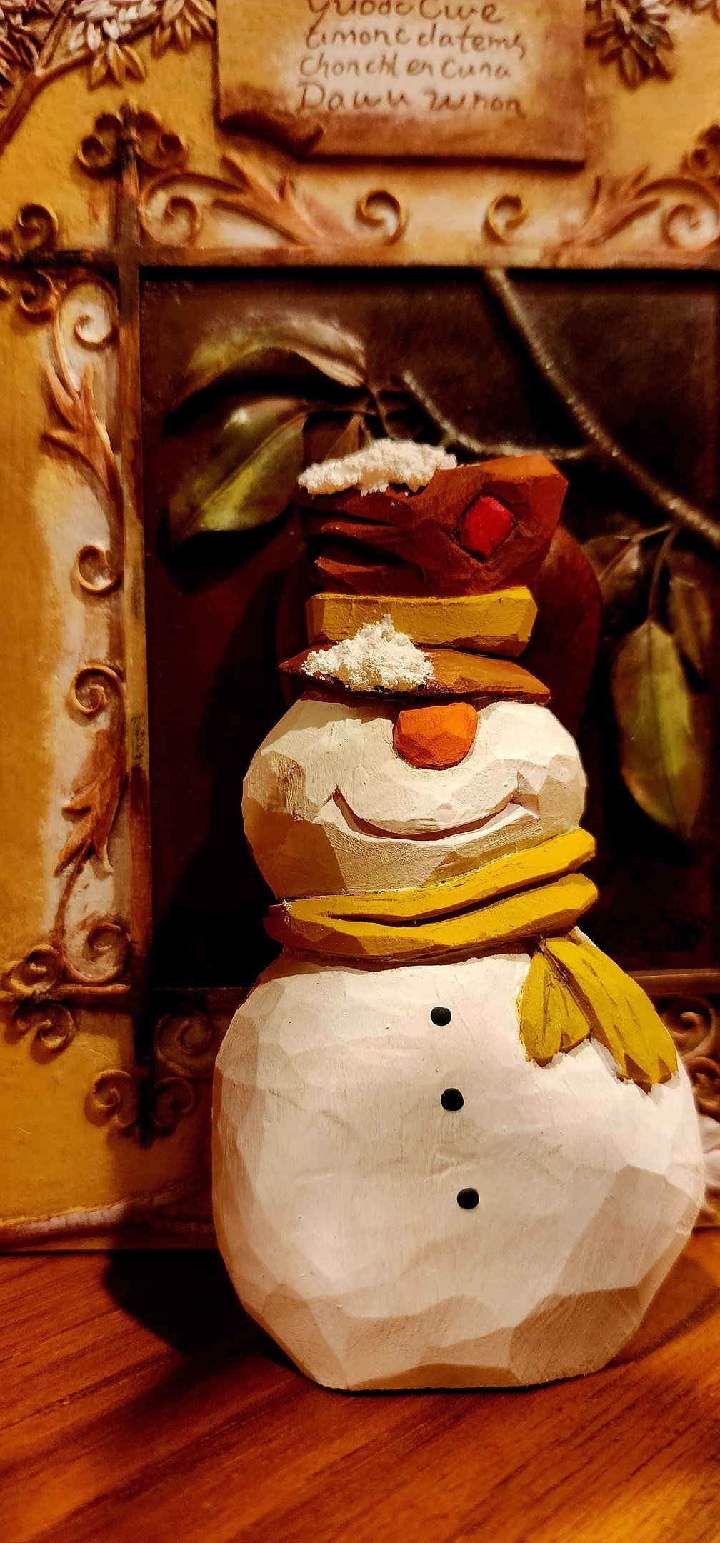 hand carved snowman with tophate and scarf, carved in basswood by James Smith