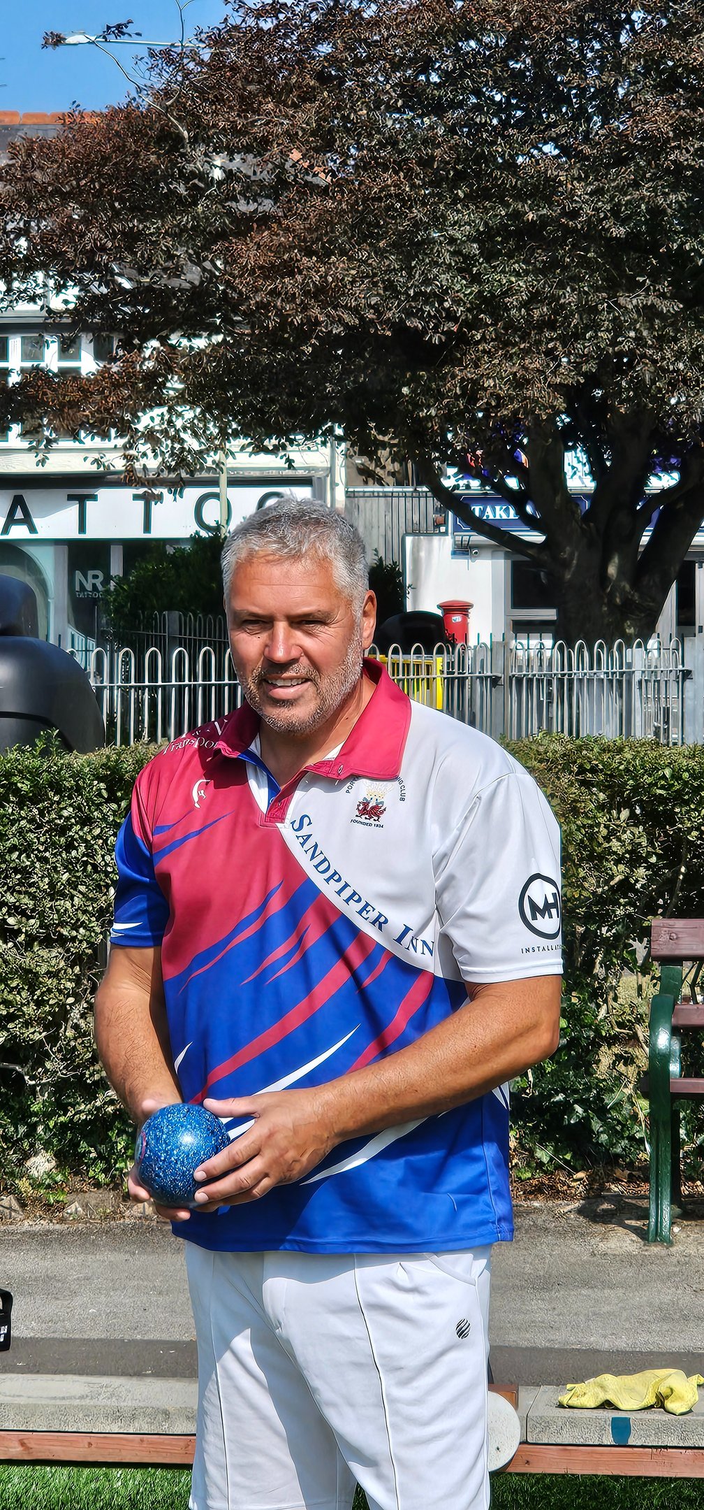 Porthcawl lawn bowls player in club shirt