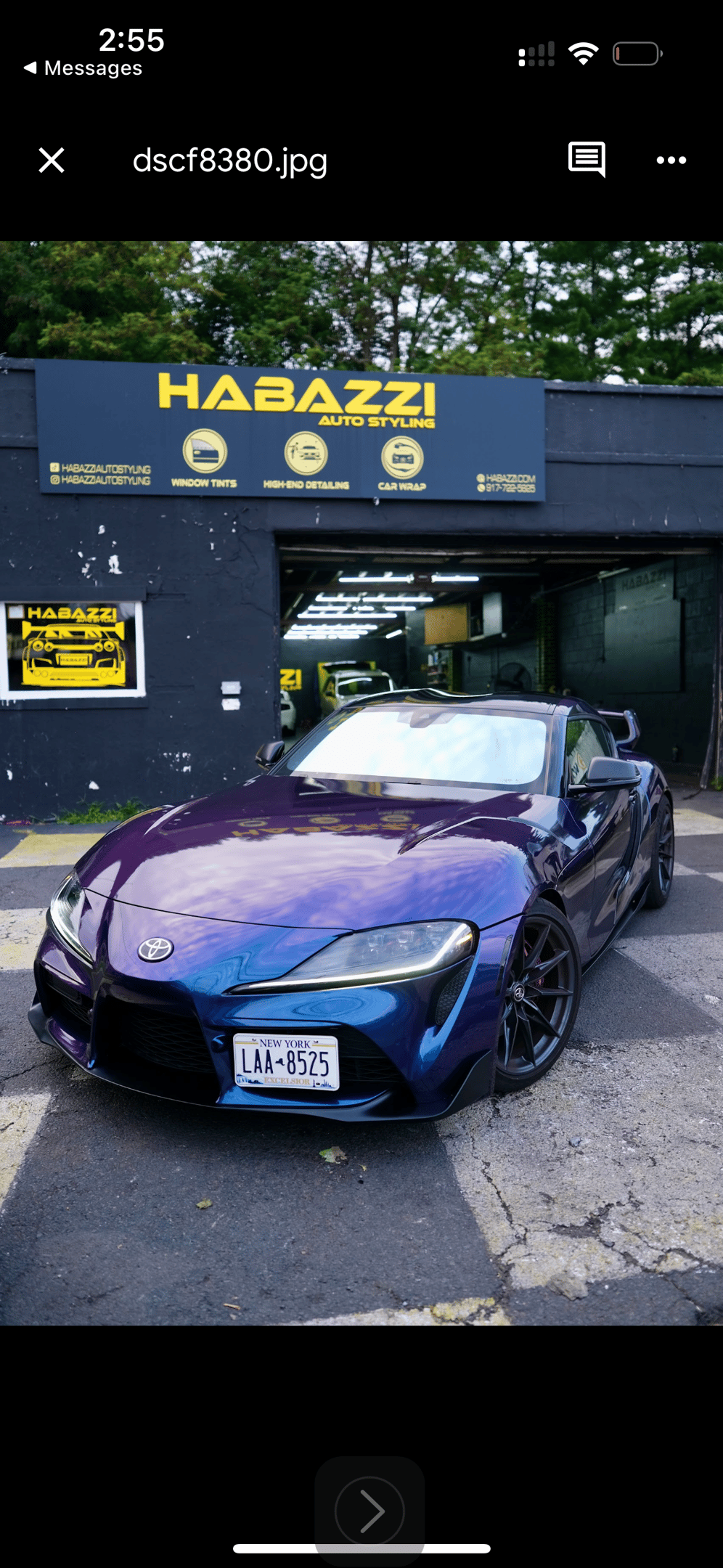 Custom purple and blue color shift car wrap on a Toyota Supra parked at Habazzi Auto Styling shop.