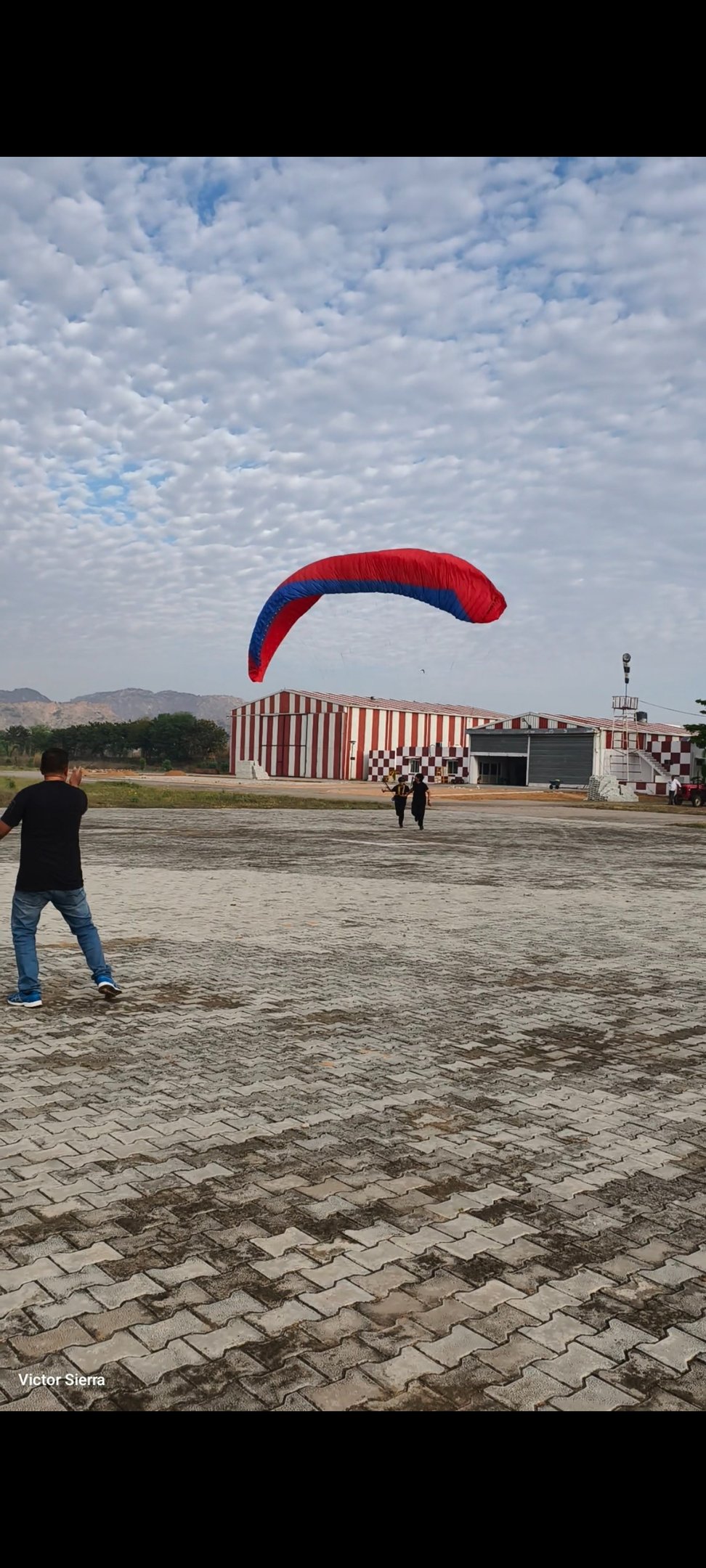 Students being taught the art of handling the paraglider on the ground
