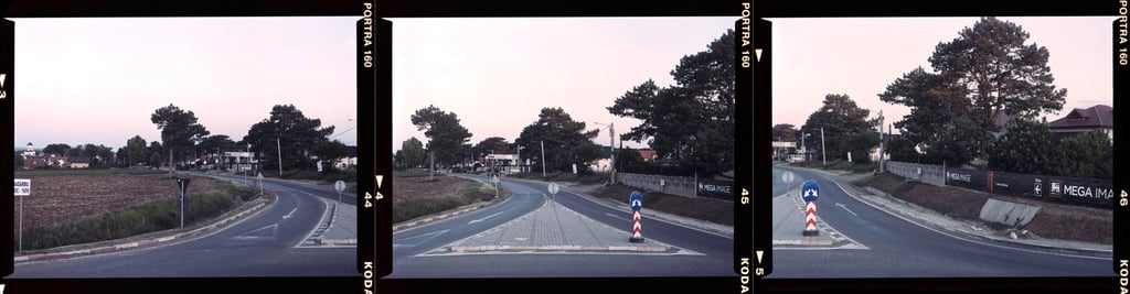 Composite color photograph of a winding road with traffic signs, captured on KODAK PORTRA film