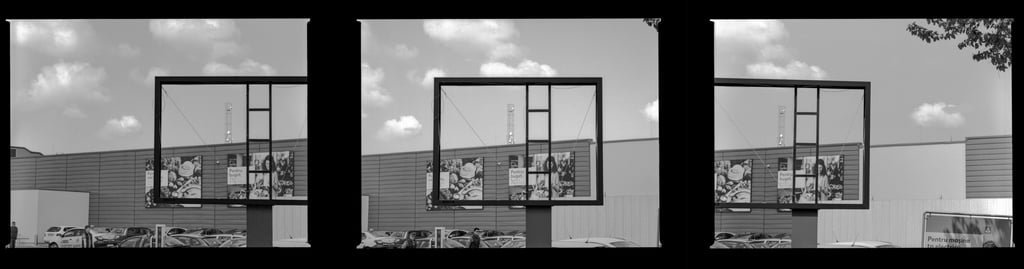 Composed image featuring a spacious vacant outdoor billboard within an commercial urban environment