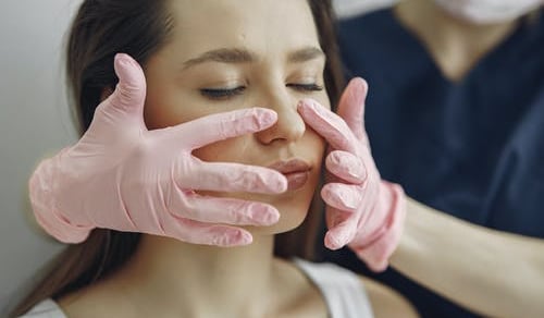 masafing face with pink gloves side by side