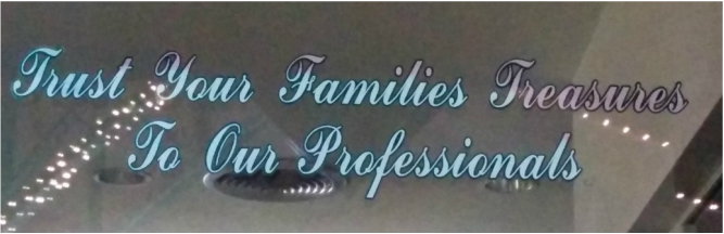 A window decal reading: "Trust Your Families Treasures To Our Professionals"