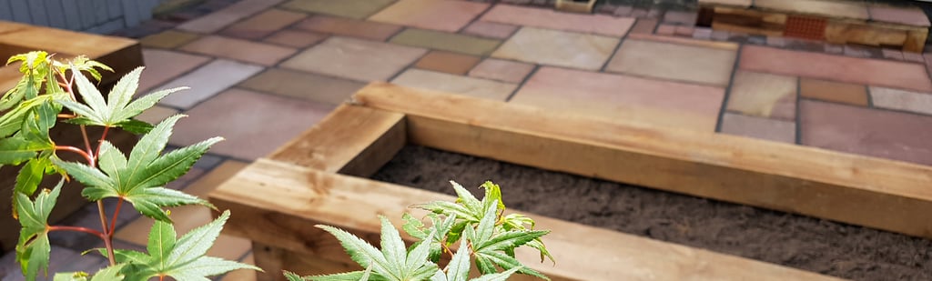 Colourful Sandstone Paving & Wooden Planters