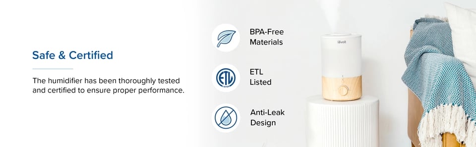 Levoit humidifier on white table beside sofa with BPA-free and ETL certification badges