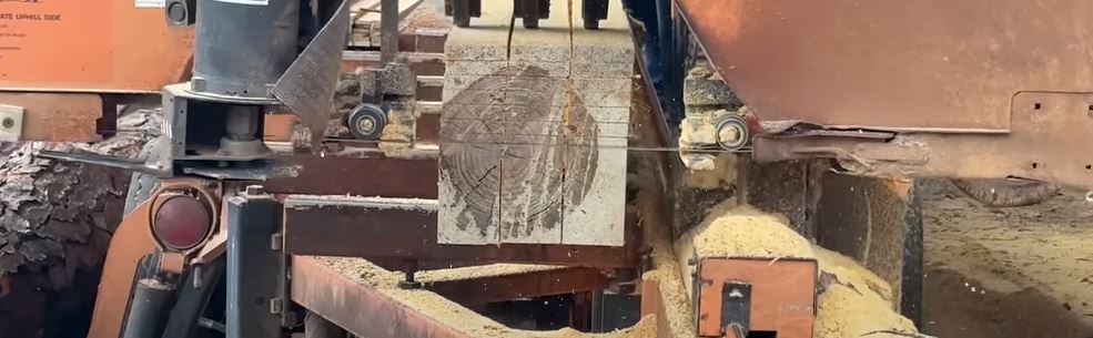 Wood-Mizer LT70 sawing lumber.