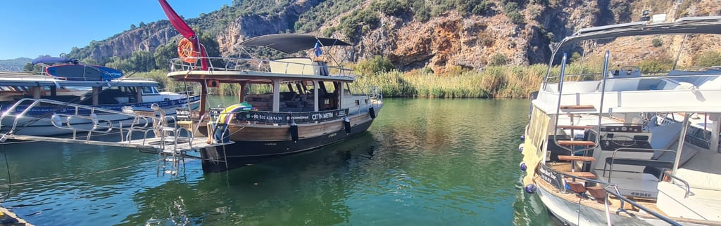 a boat is docked at a dock with a crane