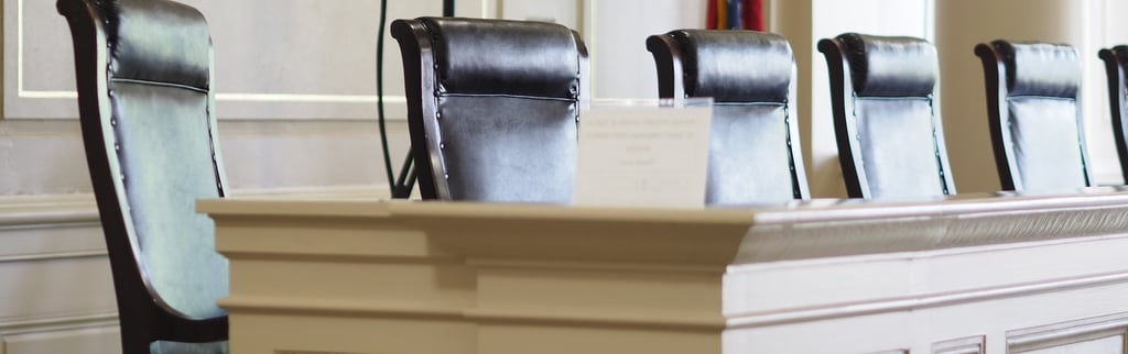 Arkansas Historic Supreme Court seats sit empty. This courthouse was established in 1836.