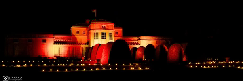Luminate Shugborough  Hall by Night illuminated in orage light