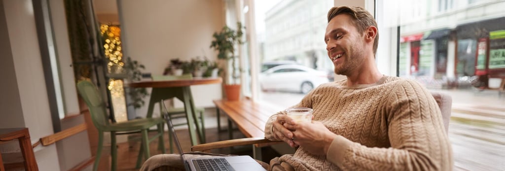 British expat working remotely in Murcia cafe with Allianz health insurance for Spanish visa