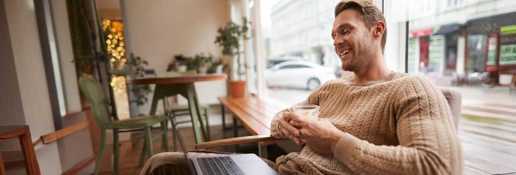 British expat working remotely in Murcia cafe with Allianz health insurance for Spanish visa