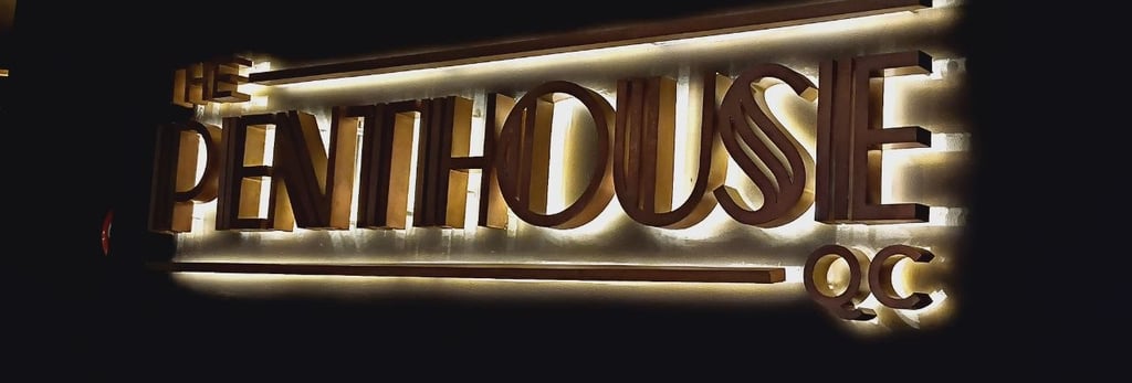 The Penthouse QC signage