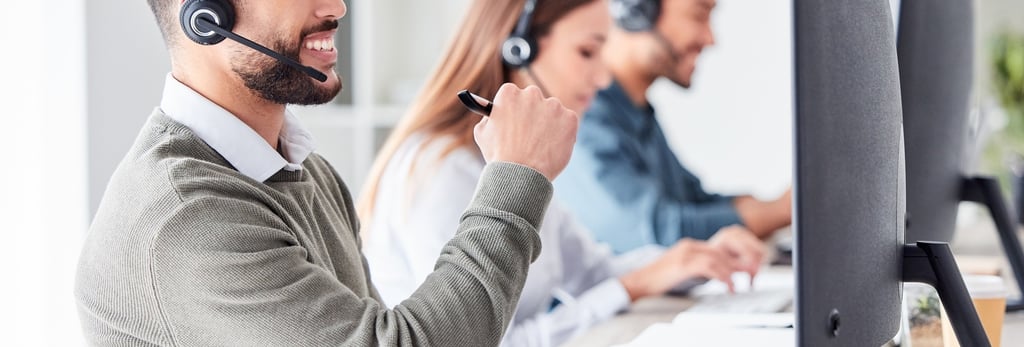 An image of helpdesk agents supporting customers over a VOIP system
