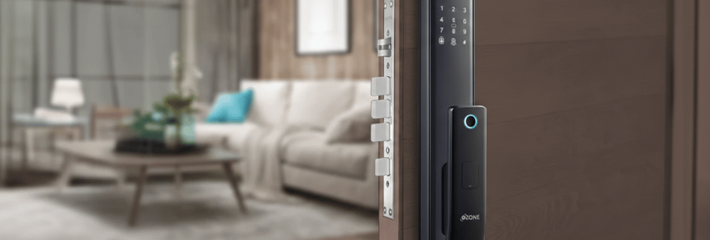 Modern smart door lock with biometric fingerprint scanner and digital keypad on a wooden home entrance.