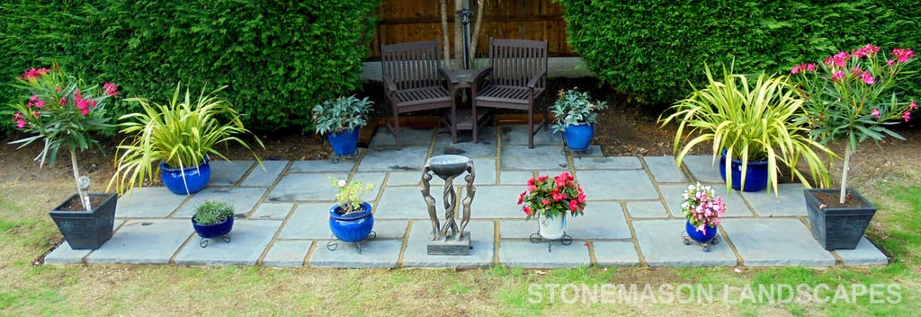 Replica antique stone grey paving slabs patio kit with bench and flowers