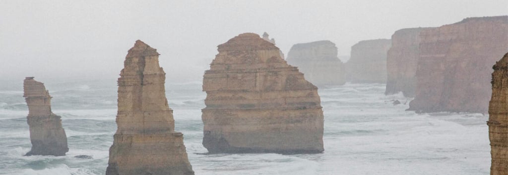 a few of rock standing on the beach
