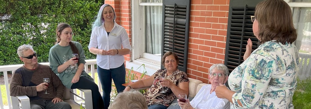 a group of people sitting on a porch