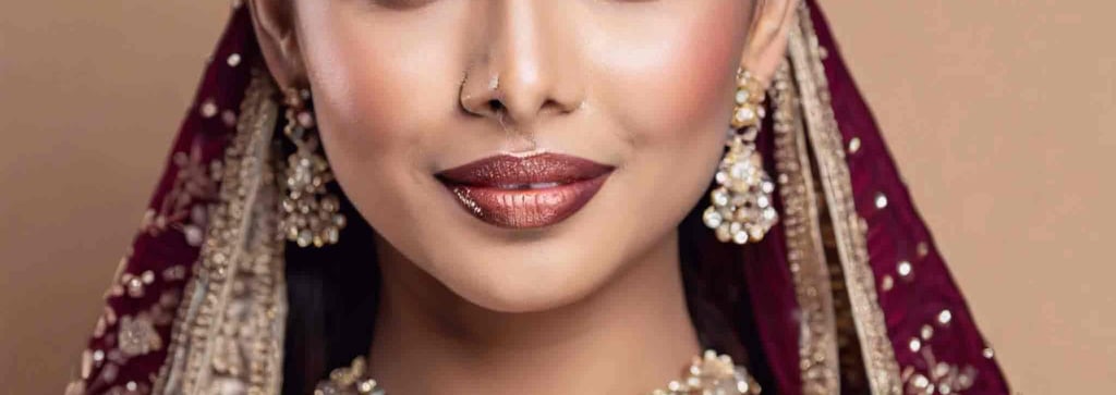 a woman in a red and gold bride