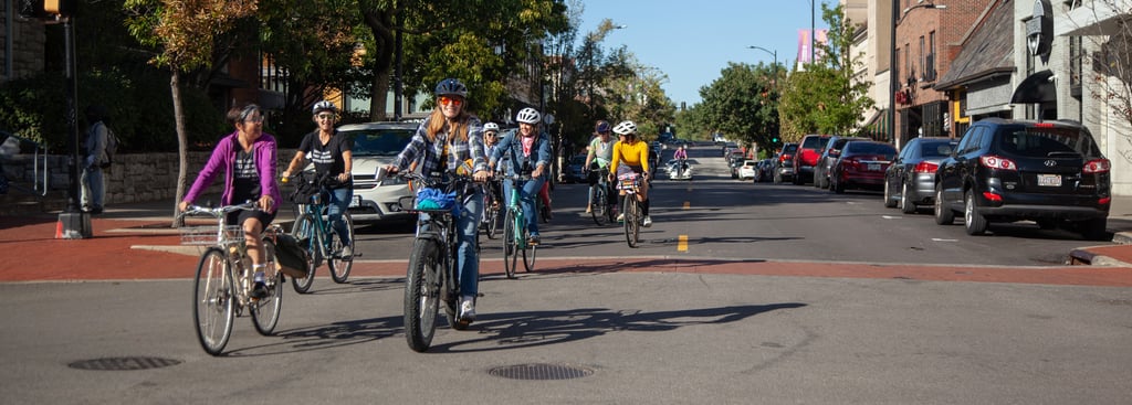 Large group of people biking downtown