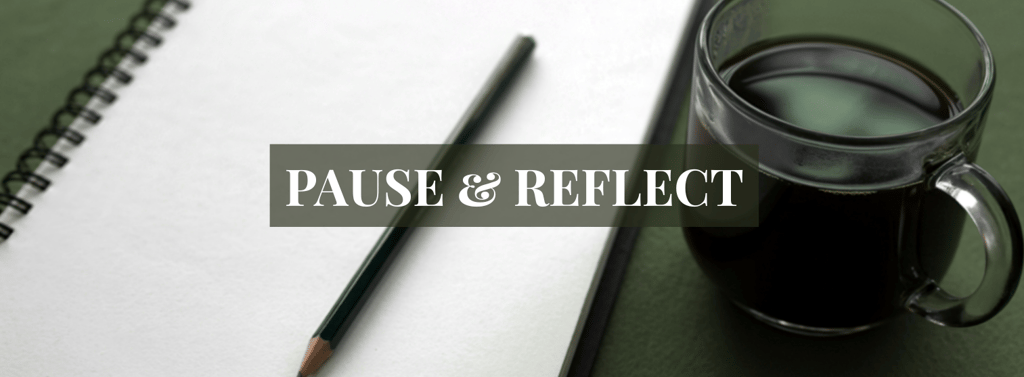 a cup of coffee and a pencil on a notebook