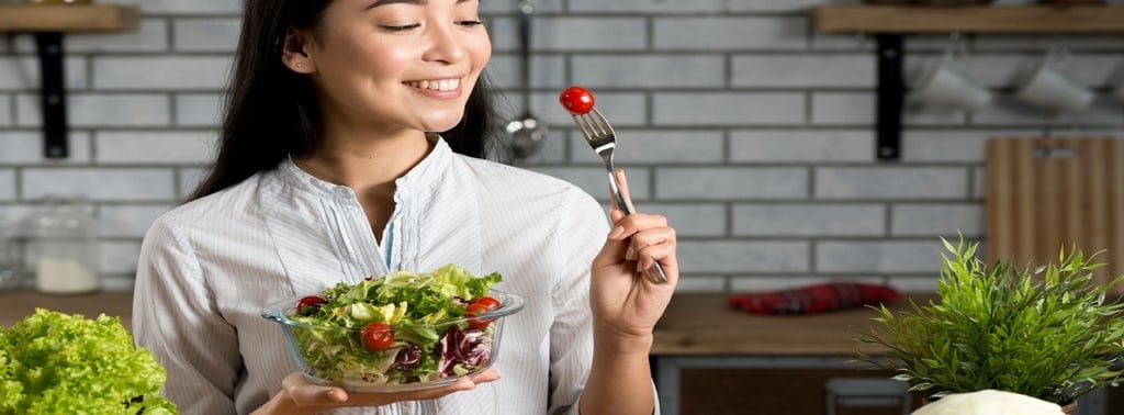A girl eating salad