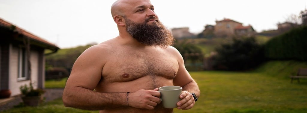 A fat man holding a Cup in the Garden