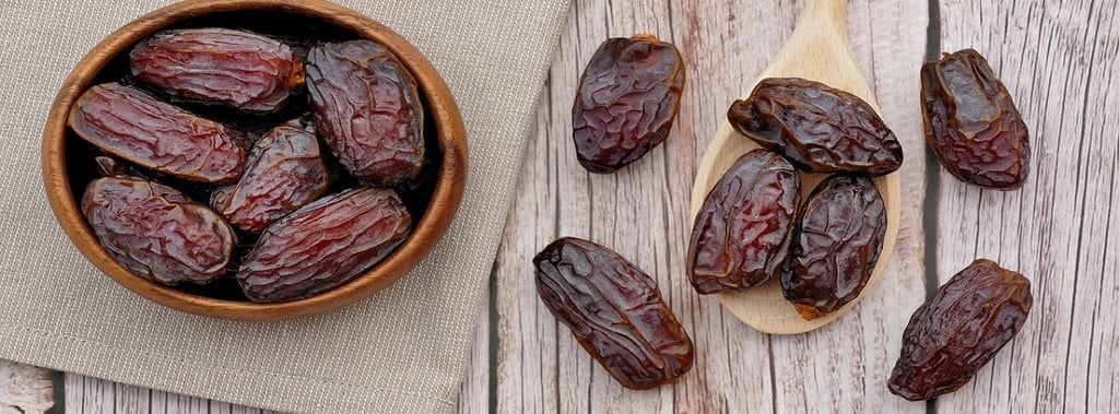 Dates in a bowl and on the table