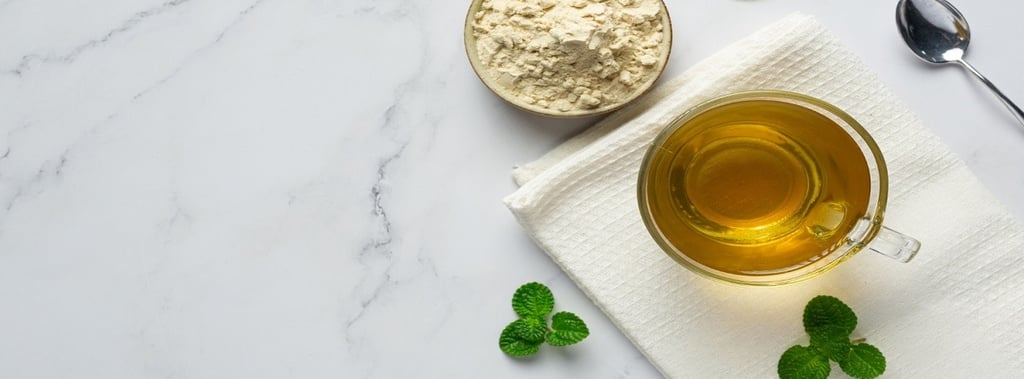 Stevia powder in a bowl, stevia leaves and tea in a glass cup