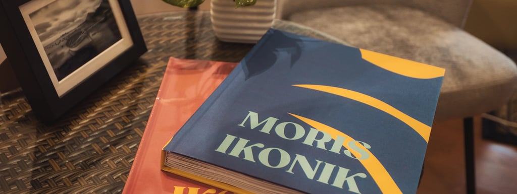 Moris Ikonik coffee table books on a rattan table in Mauritius