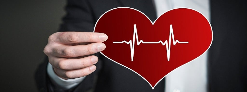 Man holding heart with pulse