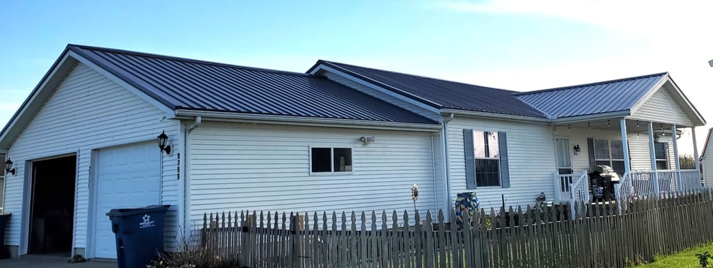 Steel roof attached to local home by Gotcha Covered Builders.
