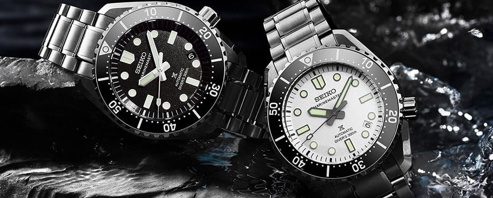 two watches on a rock wall in a river