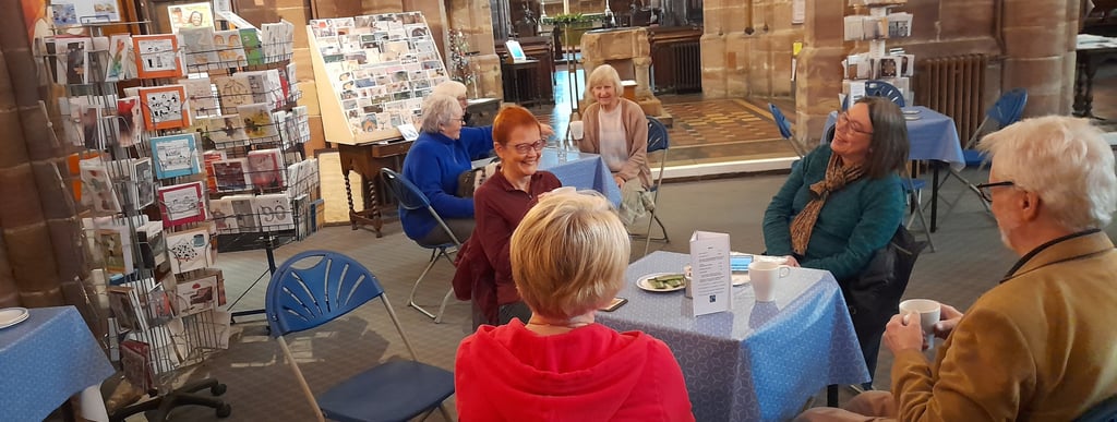 People enjoying a chat and refreshments at the Fairtrade Cafe in Halesowen.