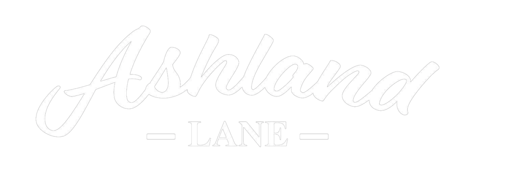 White Ashland Lane script logo with a minimalist black background for a modern brand identity.