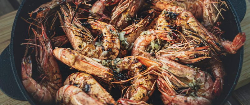 grilled shrimp in a pot with seasoning