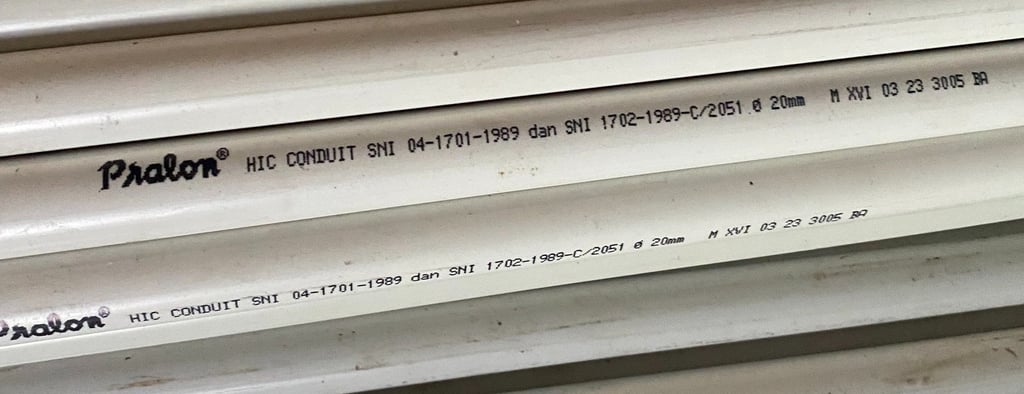 a stack of pipes and pipes in a warehouse Distributor Pralon