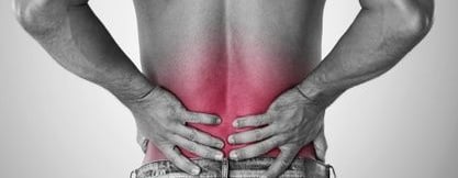 a man with a back pain in a back pain