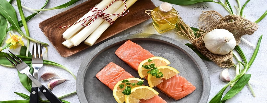 Fish fillet on a plate and garlic